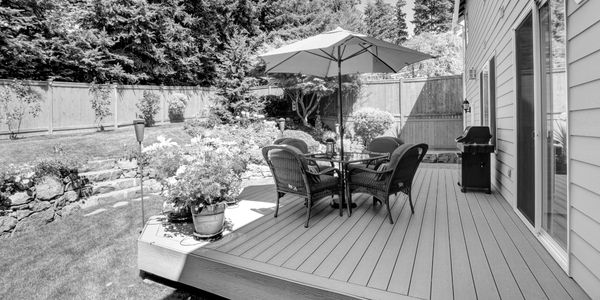 Garden patio with chairs in a sunny garden