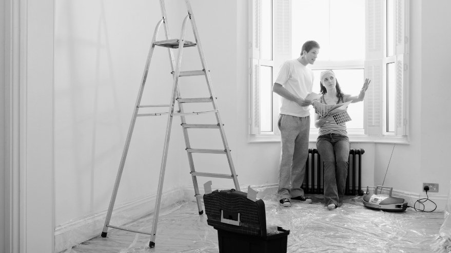 Couple painting a room