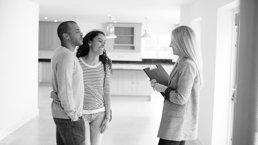 Couple talking to a real estate agent