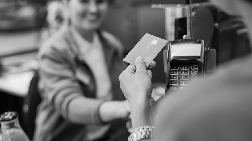 credit card being used to pay at the till