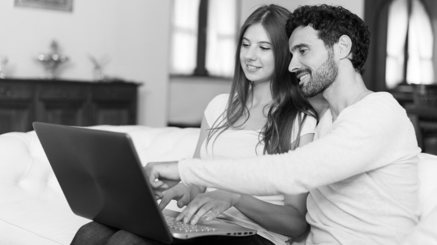 Couple looking at a laptop