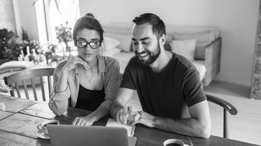 Couple using laptop