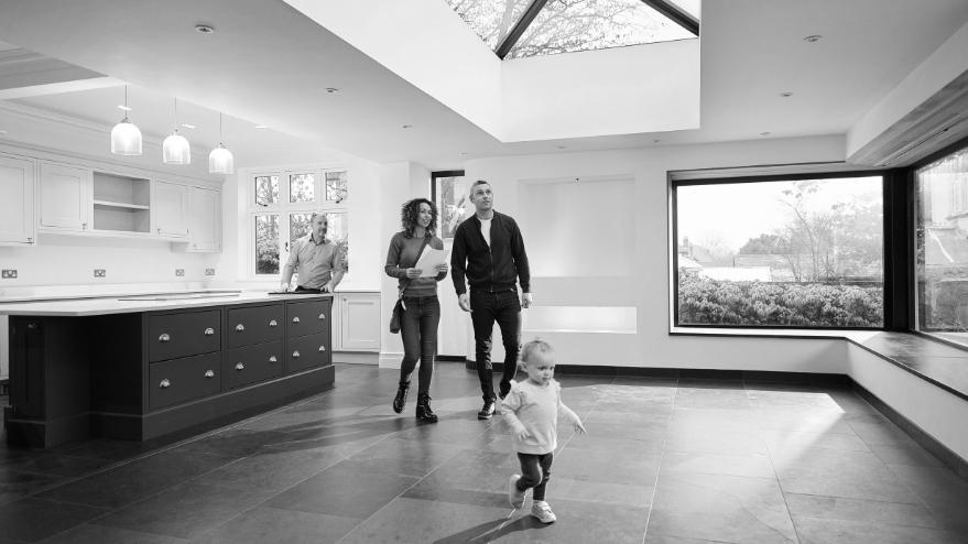 Couple viewing a house with their young child